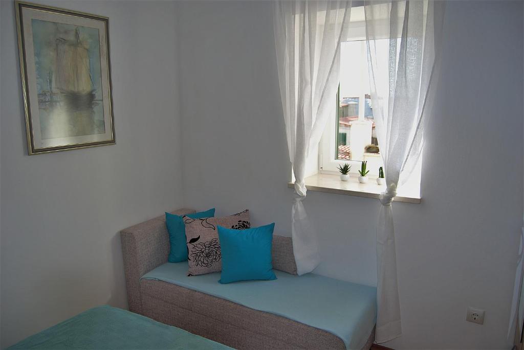 Posteľ alebo postele v izbe v ubytovaní Apartments Vidilica