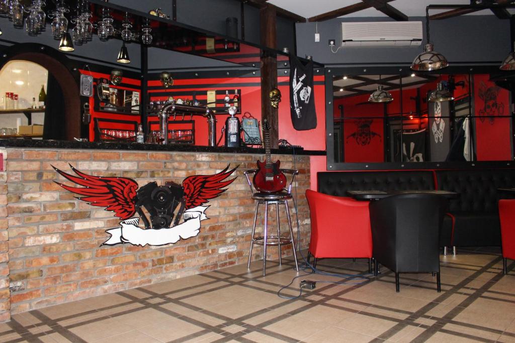 a bar with a bull head on a brick wall at Biker's Pub in Oleksandriya