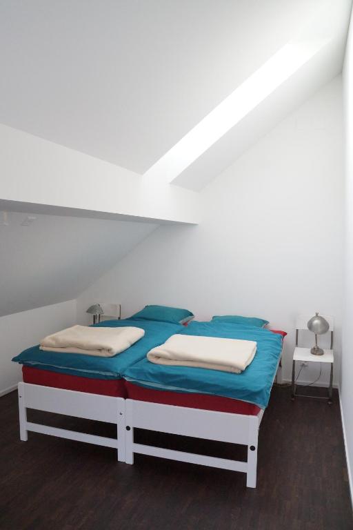 Postel nebo postele na pokoji v ubytování Ackaert Ferienwohnung Top of Thun