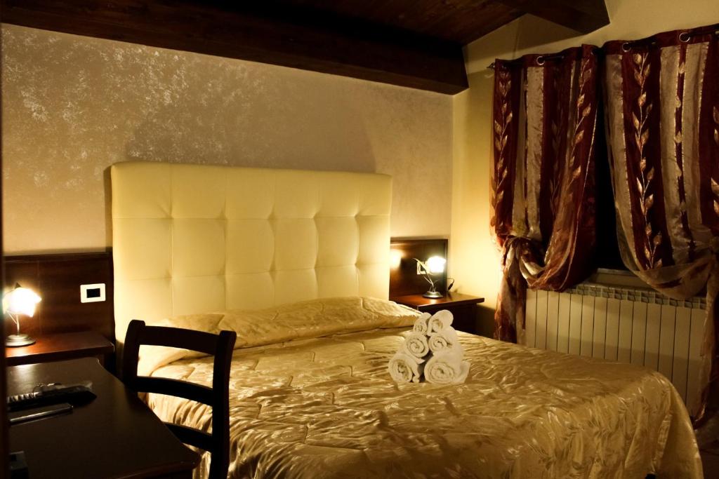 Postel nebo postele na pokoji v ubytování Agriturismo Aria Fina