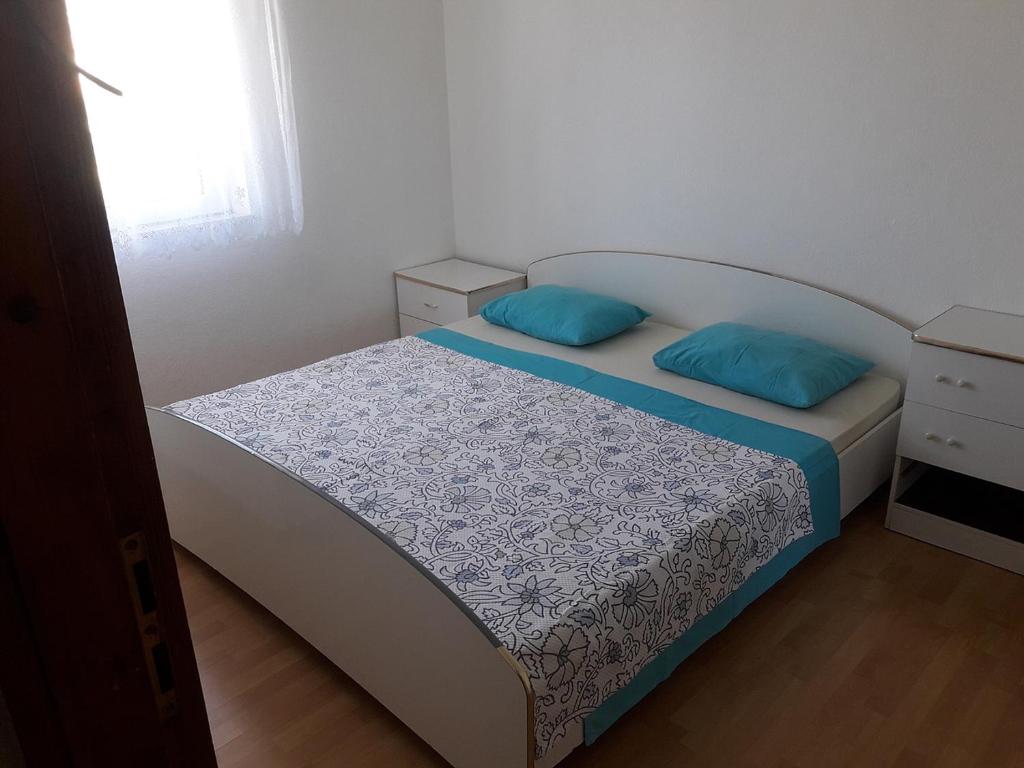 Postel nebo postele na pokoji v ubytování Apartments & Rooms Tony