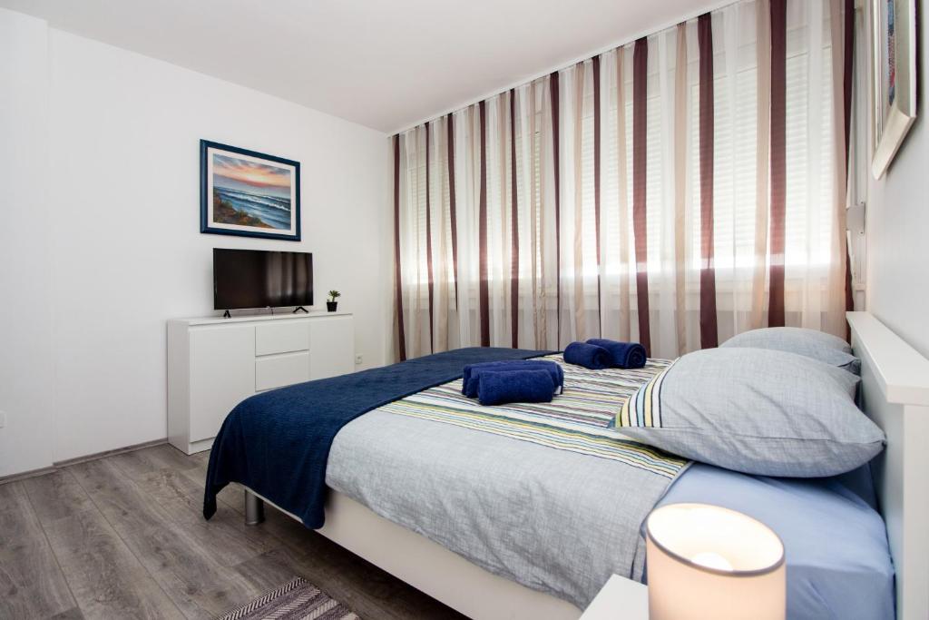 Posteľ alebo postele v izbe v ubytovaní Deluxe Apartment Miro