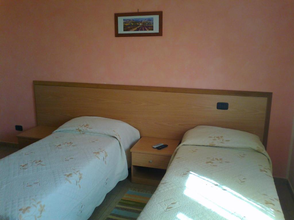 Łóżko lub łóżka w pokoju w obiekcie Life Hotel