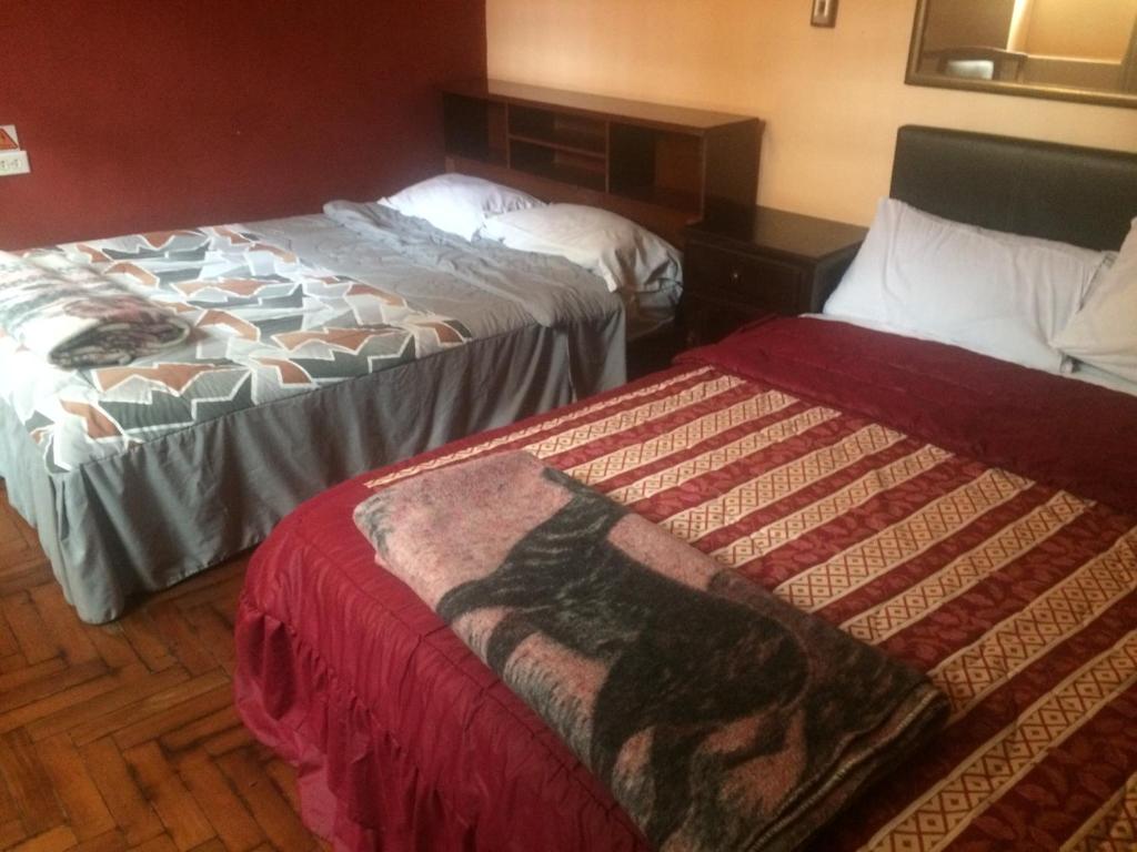 Postel nebo postele na pokoji v ubytování Hostel Del Piamonte 2