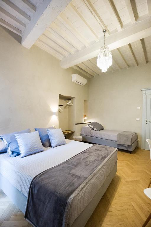 Posteľ alebo postele v izbe v ubytovaní Il Piccolo Cavour Charming House B&B