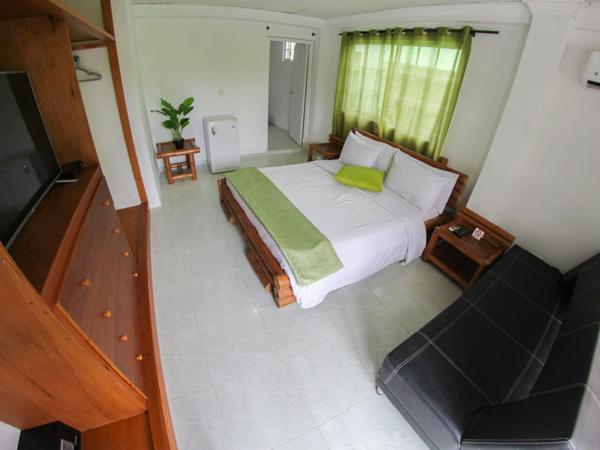 Postel nebo postele na pokoji v ubytování Casa Royal Palm Inn