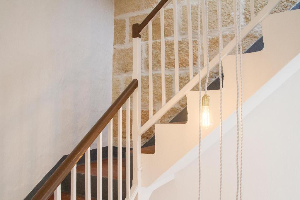 
a staircase leading up to a stair case at Hotel Romantic Los 5 Sentidos in Ciutadella

