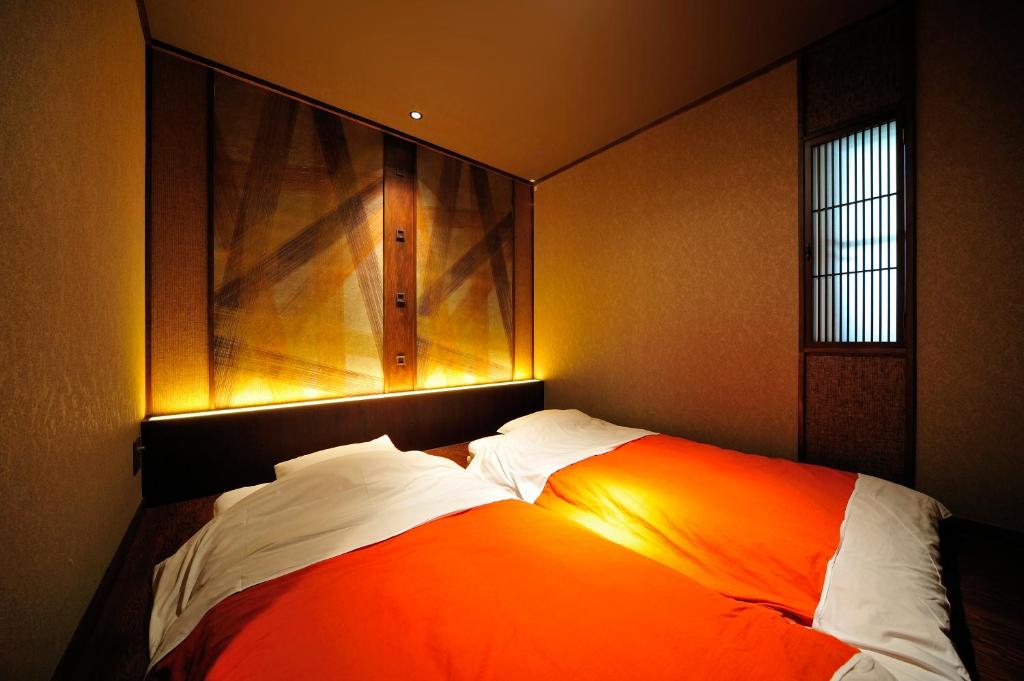 Postel nebo postele na pokoji v ubytování Hakone Onsen Ryokan Yaeikan