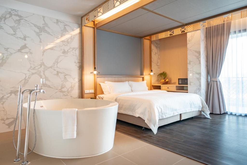 Postel nebo postele na pokoji v ubytování Anana Ecological Resort Krabi - SHA Extra Plus