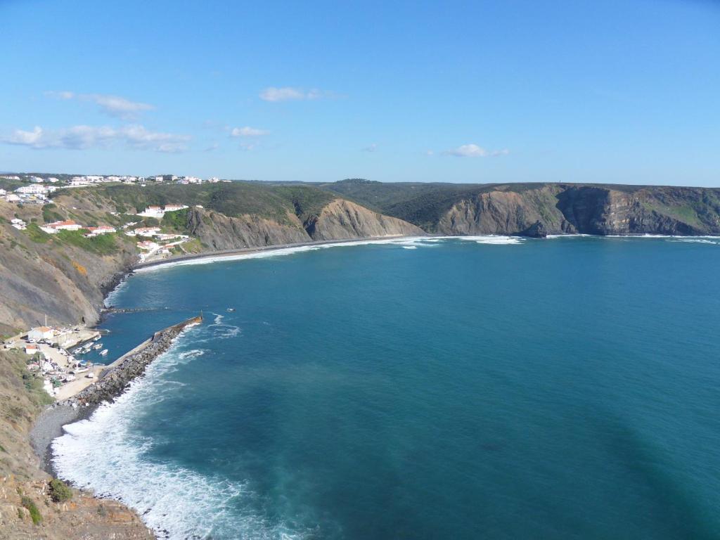 an aerial view of a beach with the ocean at Moradia Vale da Telha in Aljezur