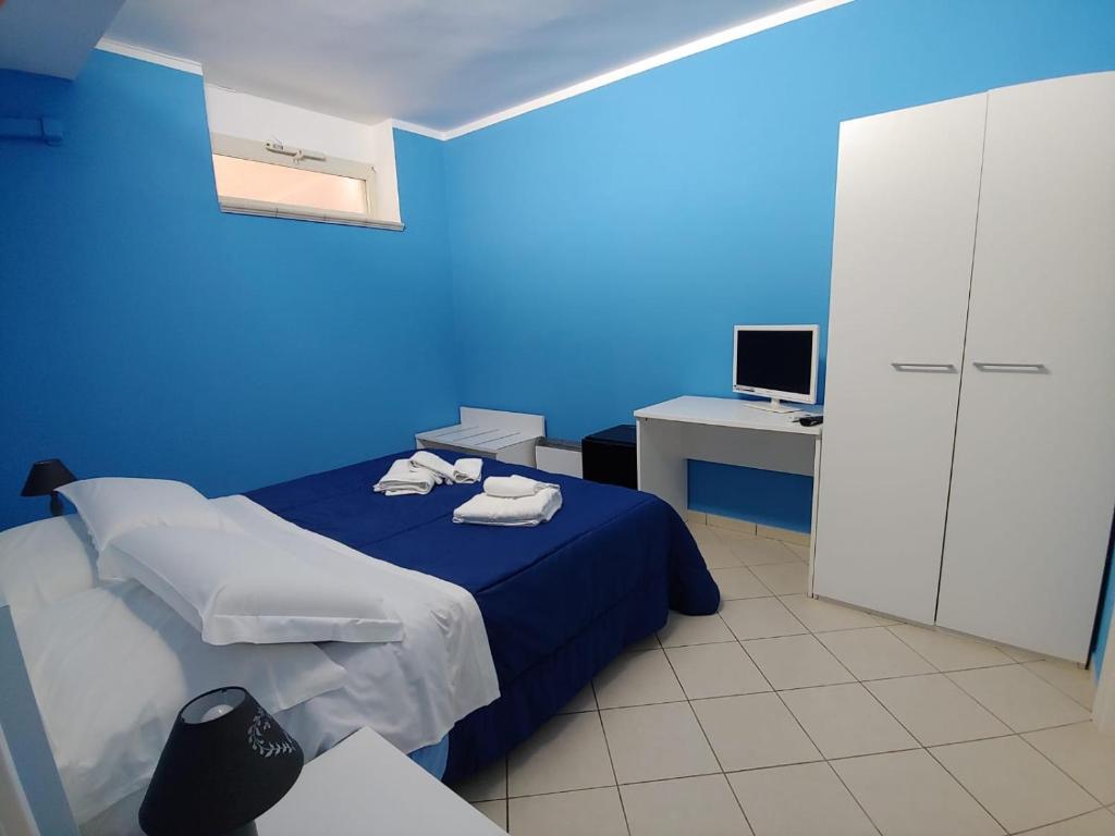 Postel nebo postele na pokoji v ubytování SORRENTO RELAIS BASEMENT