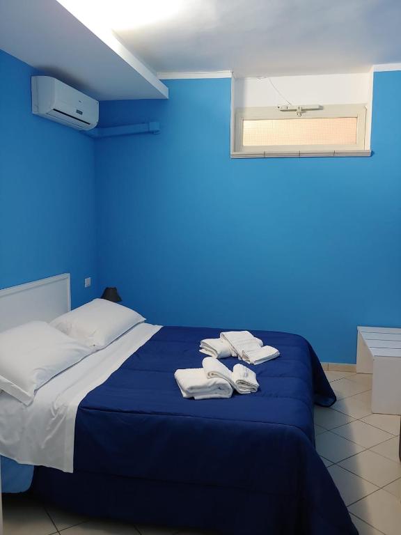 Postel nebo postele na pokoji v ubytování SORRENTO RELAIS BASEMENT