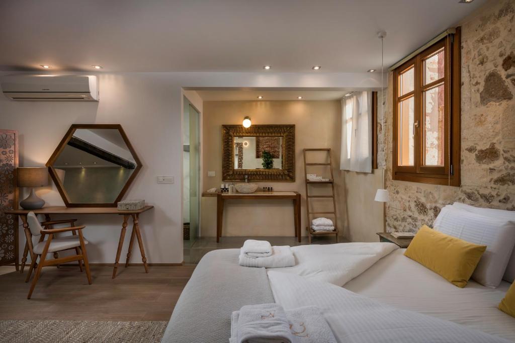 Postel nebo postele na pokoji v ubytování Residenza Vranas Boutique Hotel