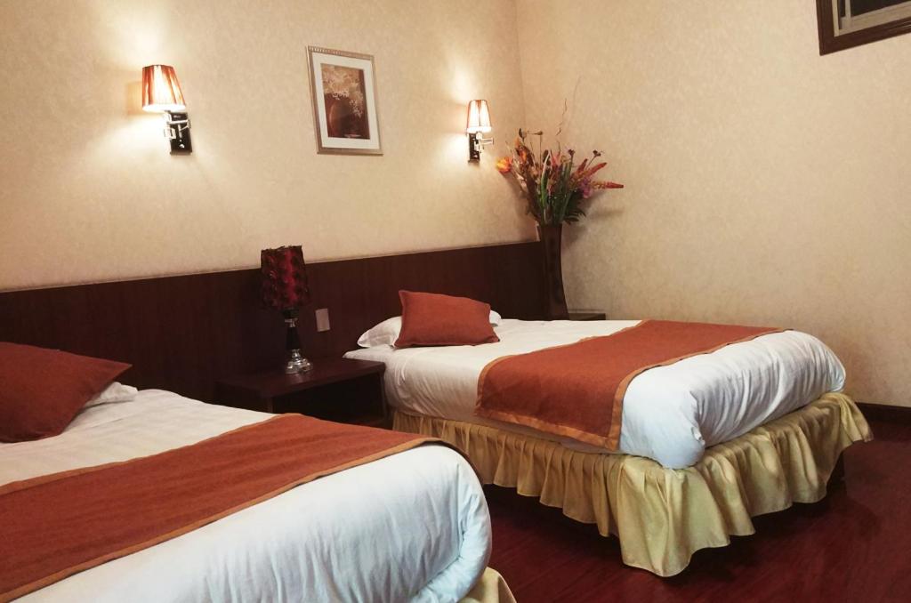 Postel nebo postele na pokoji v ubytování Hotel 198