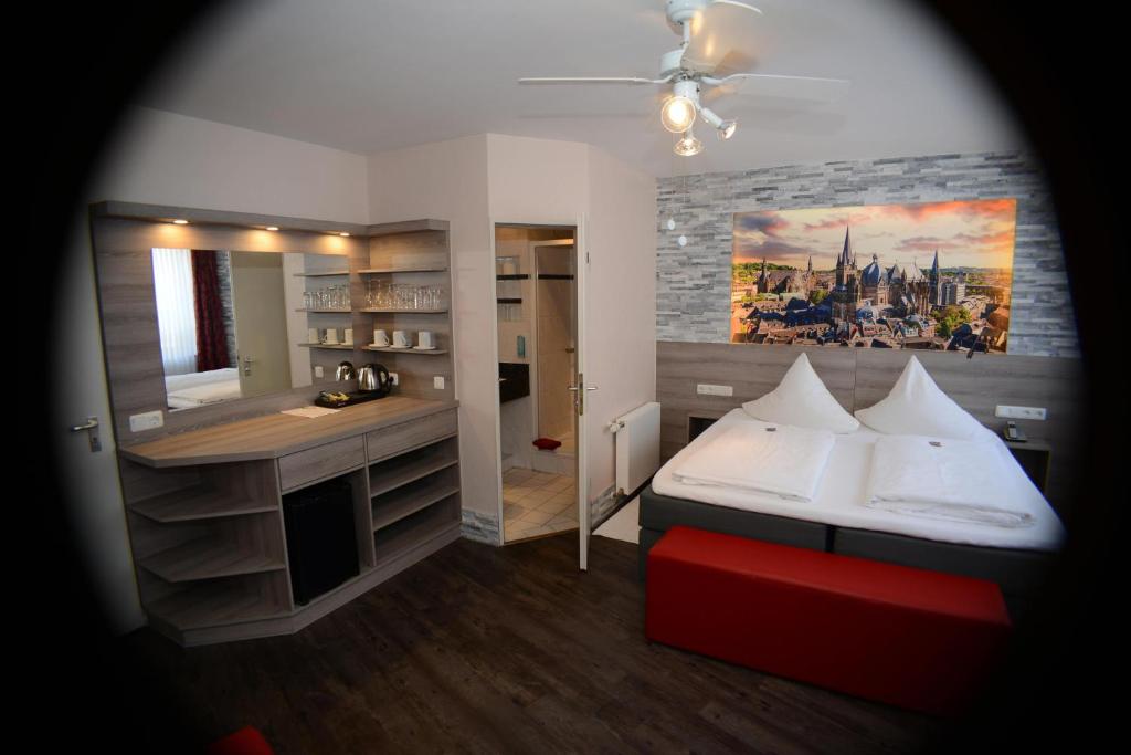 Postel nebo postele na pokoji v ubytování Hotel Granus