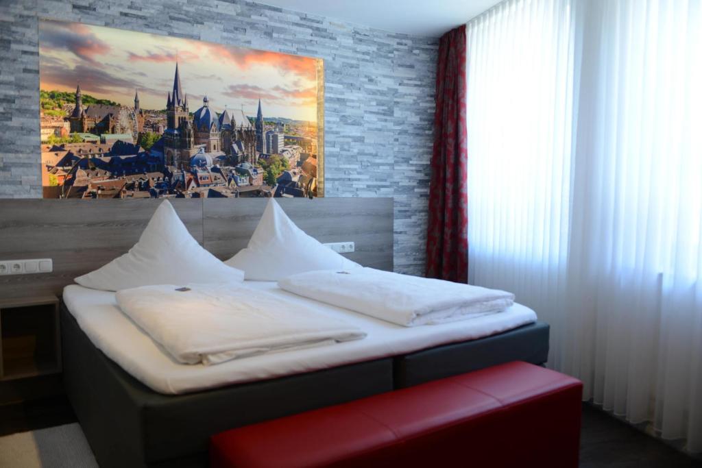 Postel nebo postele na pokoji v ubytování Hotel Granus