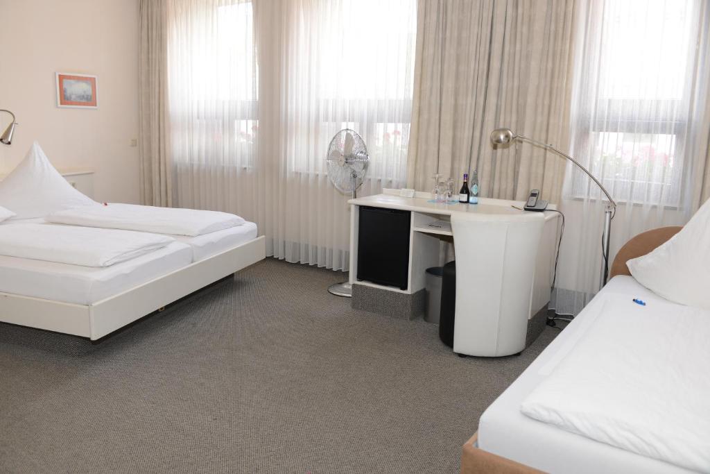 Postel nebo postele na pokoji v ubytování Hotel Granus