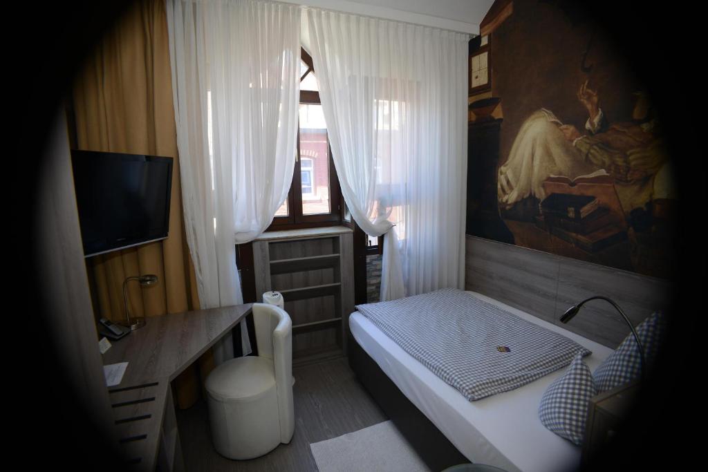 Postel nebo postele na pokoji v ubytování Hotel Granus