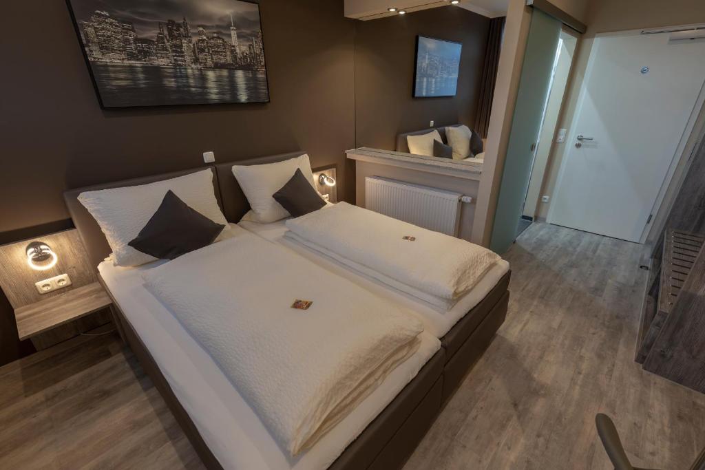 Postel nebo postele na pokoji v ubytování Mey Hotel