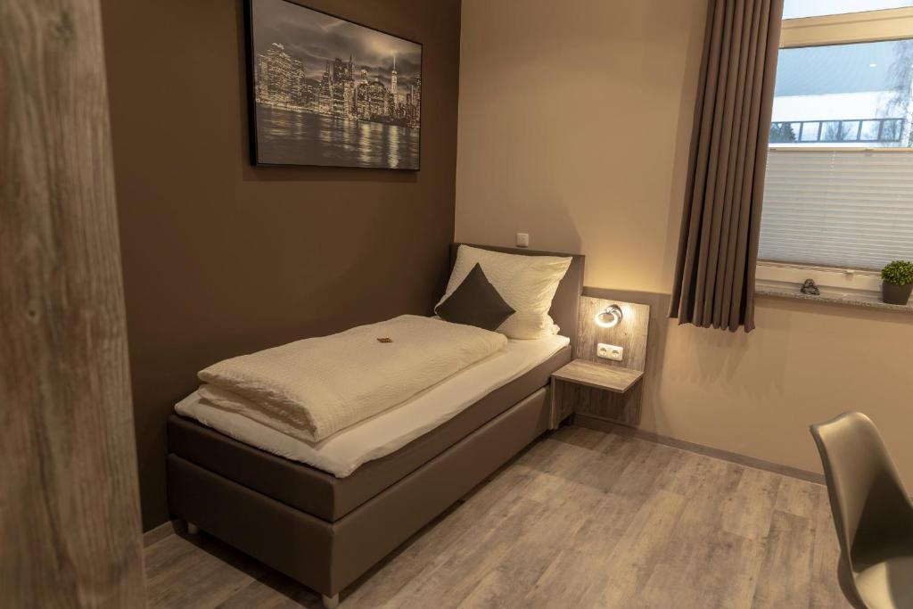 Postel nebo postele na pokoji v ubytování Mey Hotel