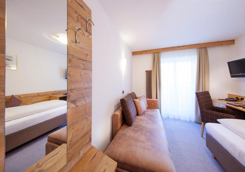 Postel nebo postele na pokoji v ubytování Garni Lanzinger