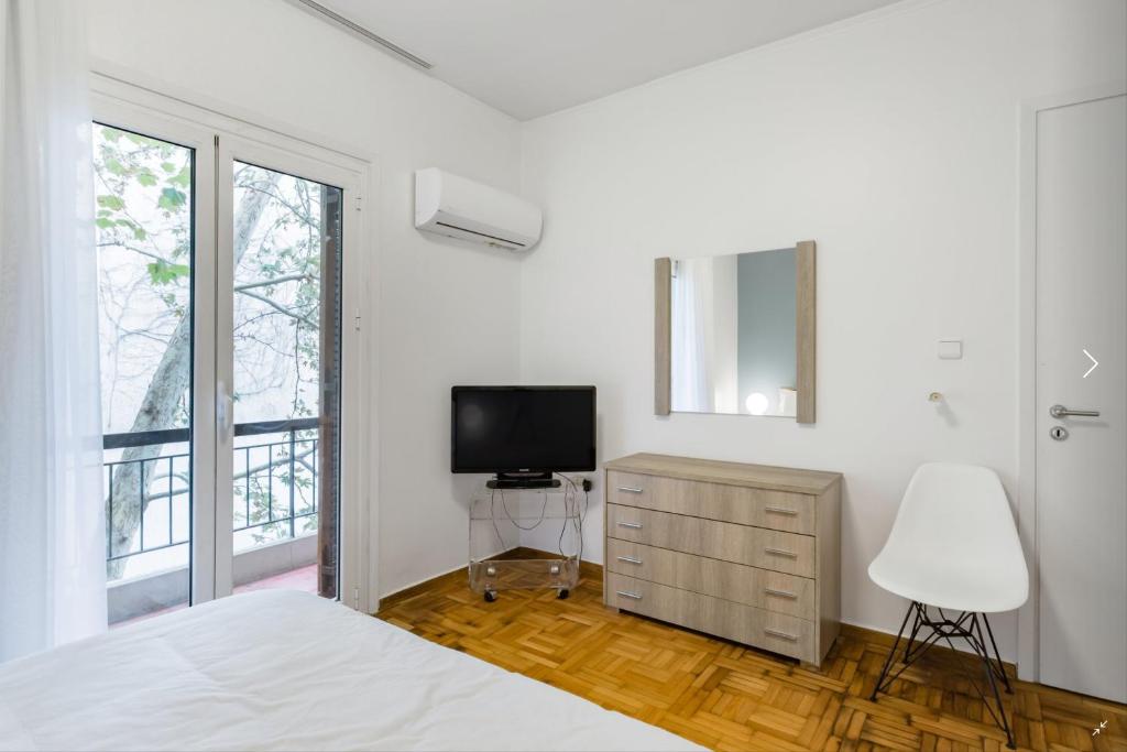 Postel nebo postele na pokoji v ubytování Athenian Riviera Beach Apartment