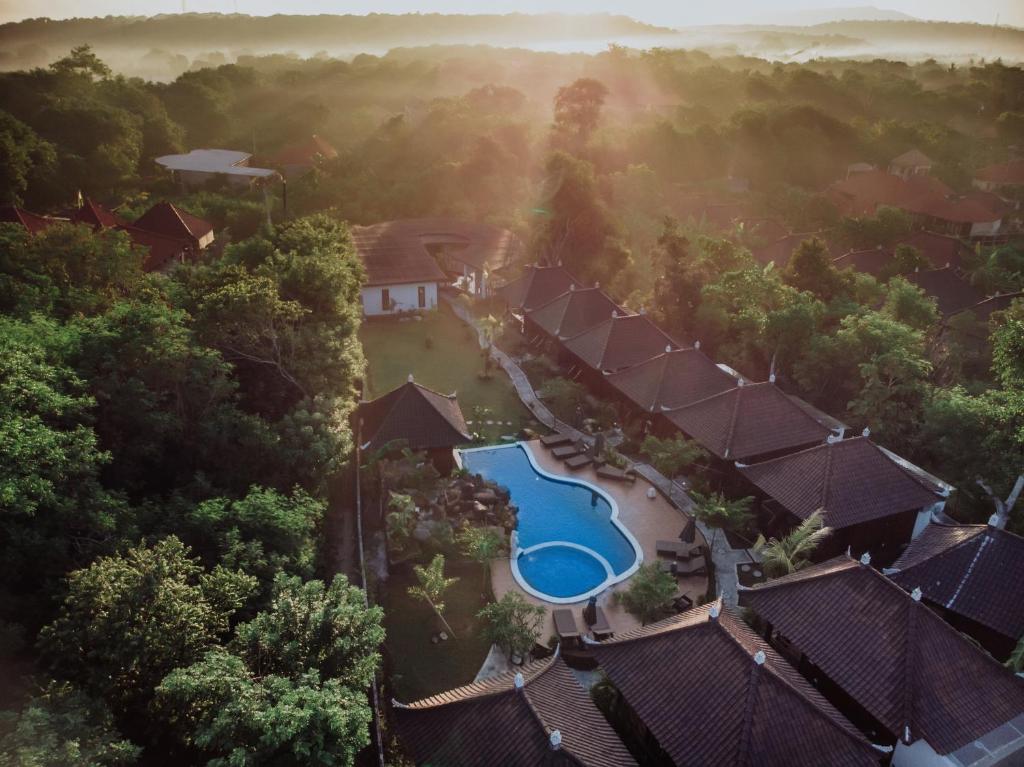 an aerial view of a resort with a pool and trees at Mamamia Island Villa in Nusa Lembongan