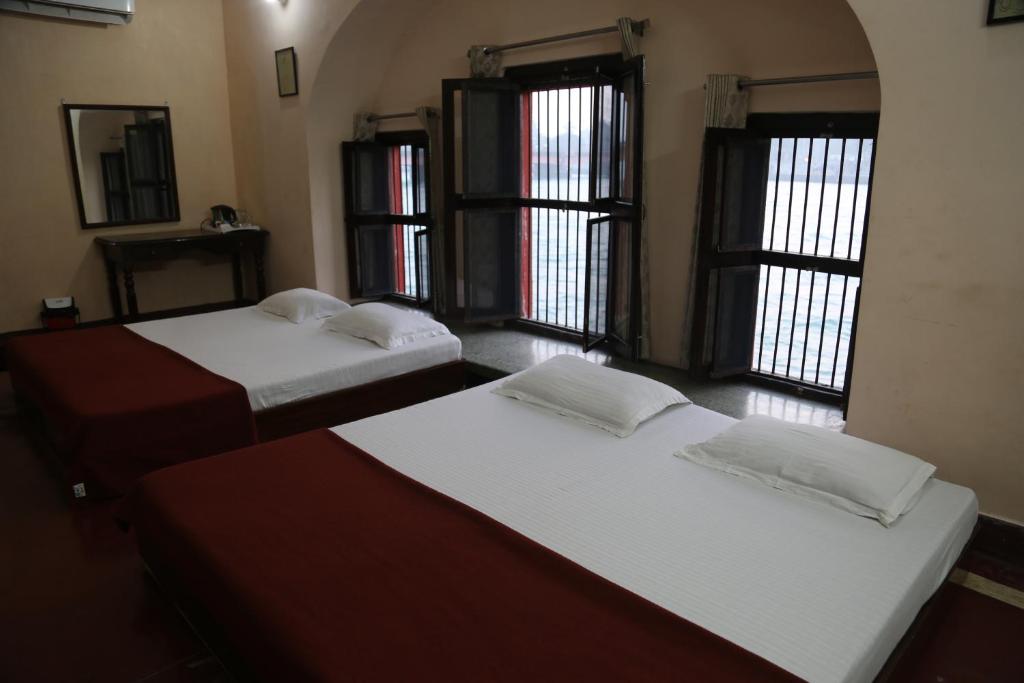 Postel nebo postele na pokoji v ubytování Patnimal Guesthouse