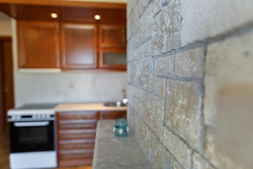 Kuchyň nebo kuchyňský kout v ubytování Glyfada Villas