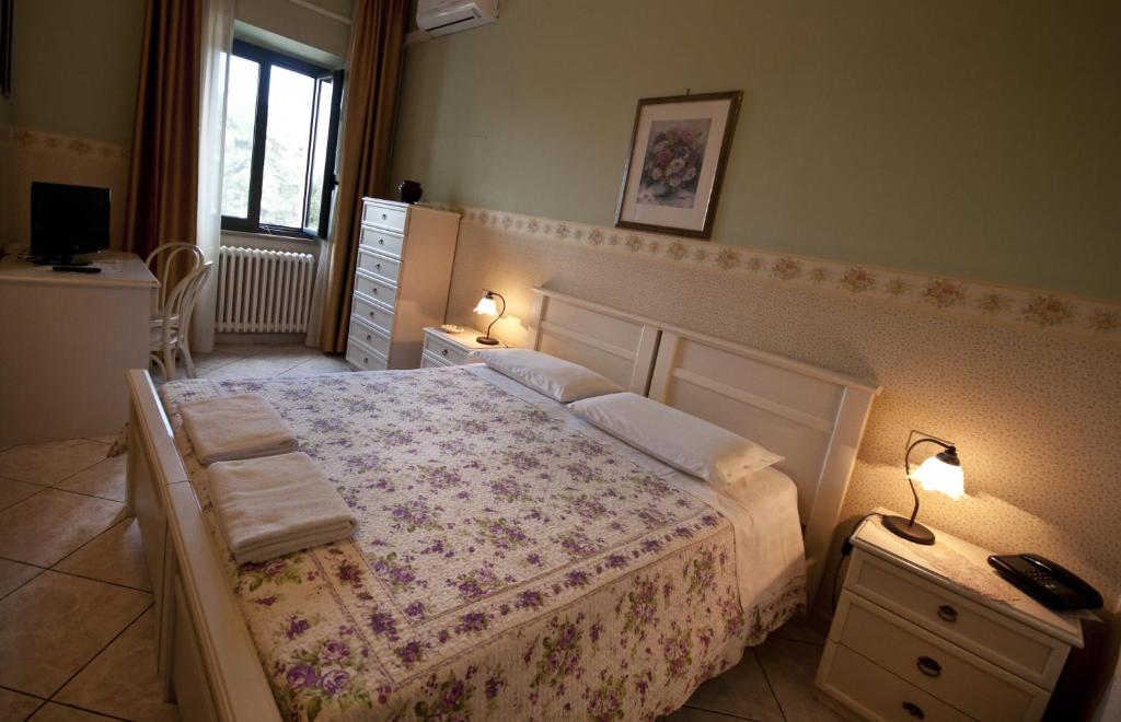 Posteľ alebo postele v izbe v ubytovaní Hotel La Villa