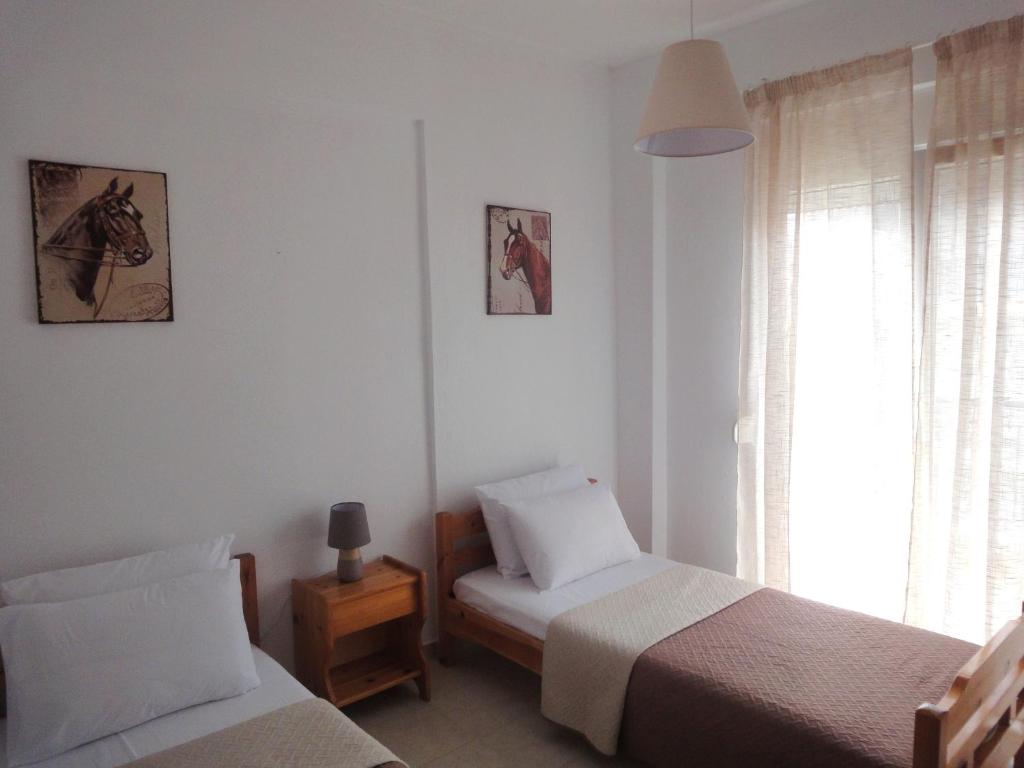 Posteľ alebo postele v izbe v ubytovaní Polychrono Nikos Apartment