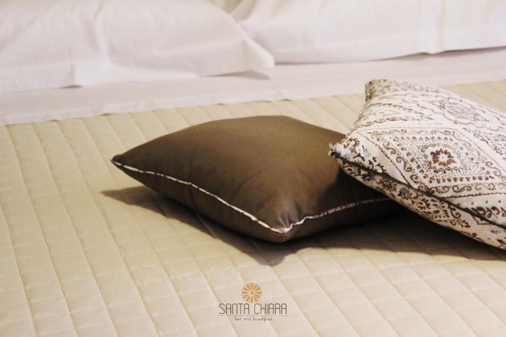 A bed or beds in a room at B&B Dimora Santa Chiara