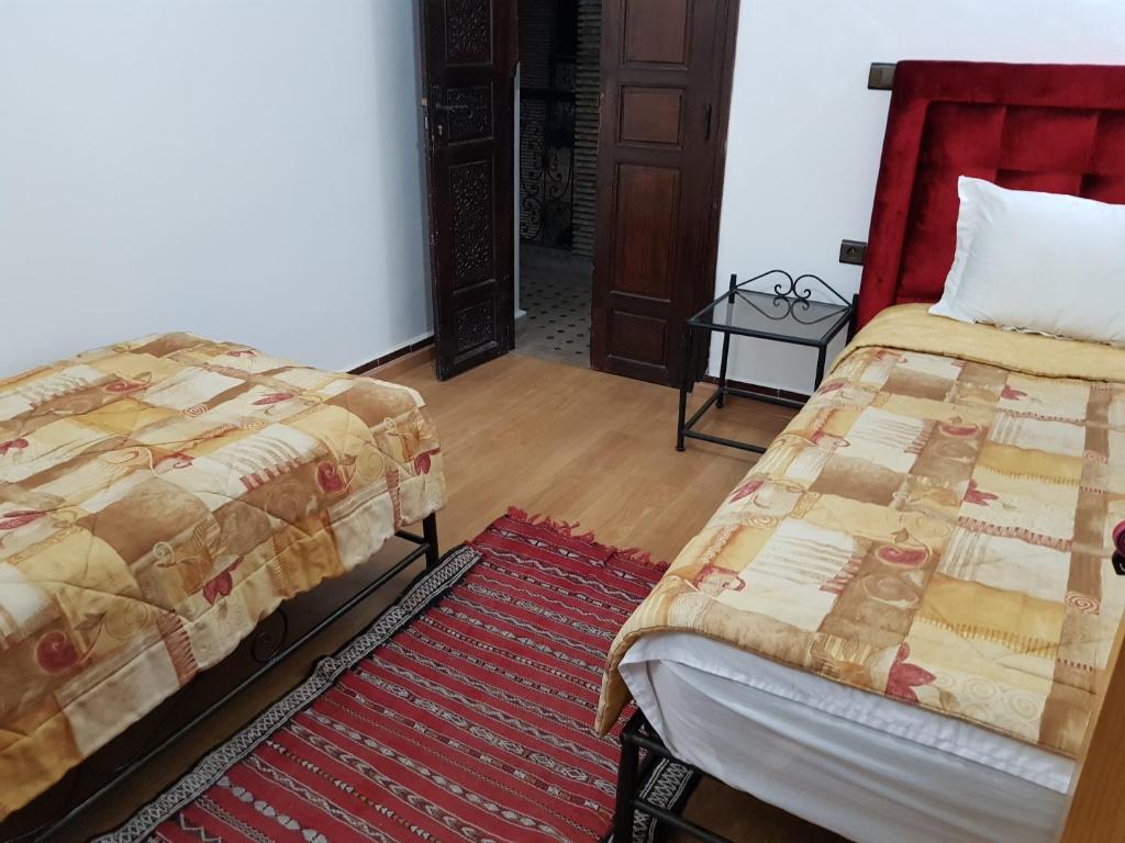 Postel nebo postele na pokoji v ubytování Riad Assia
