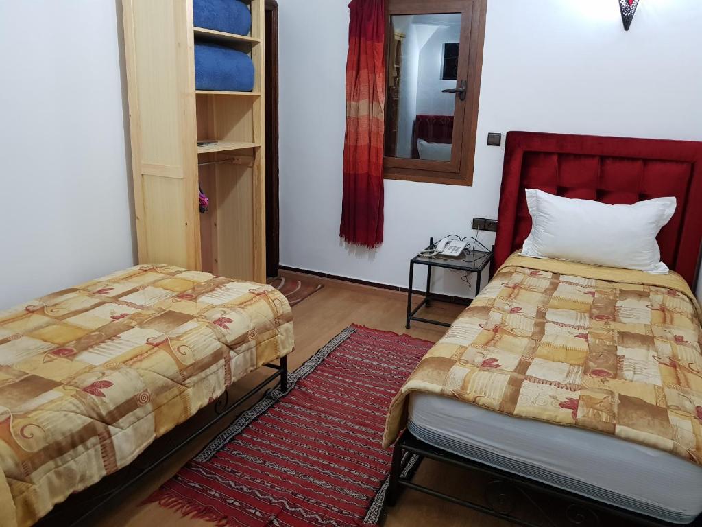 Postel nebo postele na pokoji v ubytování Riad Assia