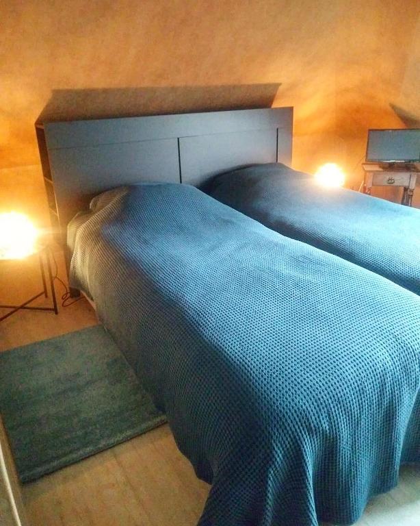 Postel nebo postele na pokoji v ubytování Hostellerie de la Chapelle