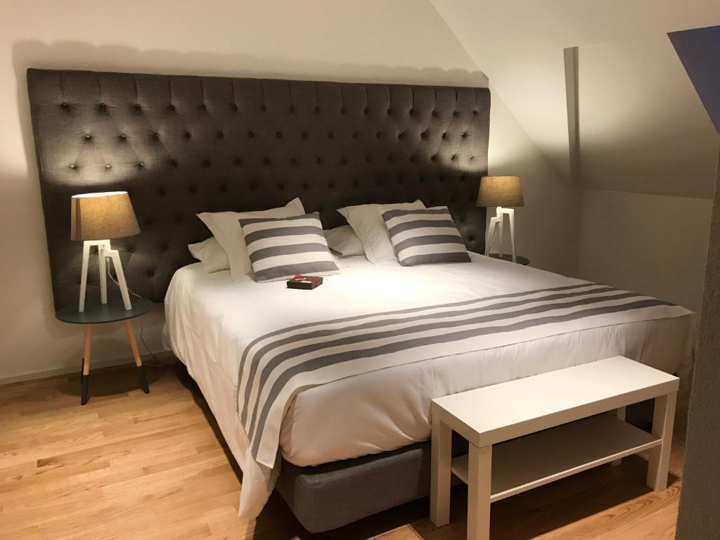 Postel nebo postele na pokoji v ubytování L’Auberge de Mézières