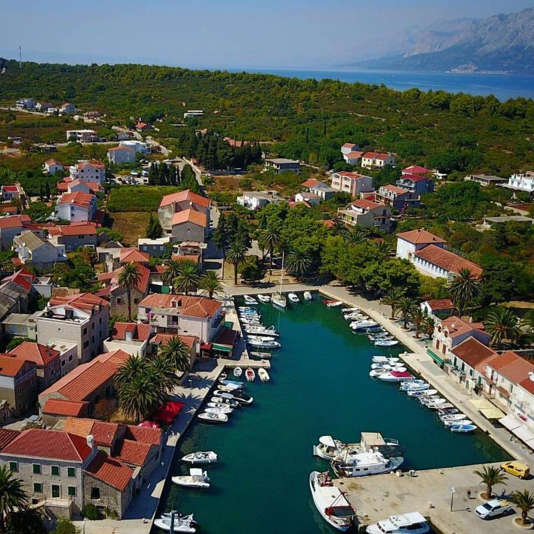 an aerial view of a harbor with boats in the water at Apartman Sucuraj in Sućuraj