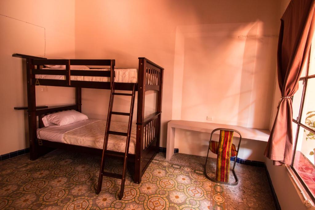Postel nebo postele na pokoji v ubytování Casa de Juan Hostal
