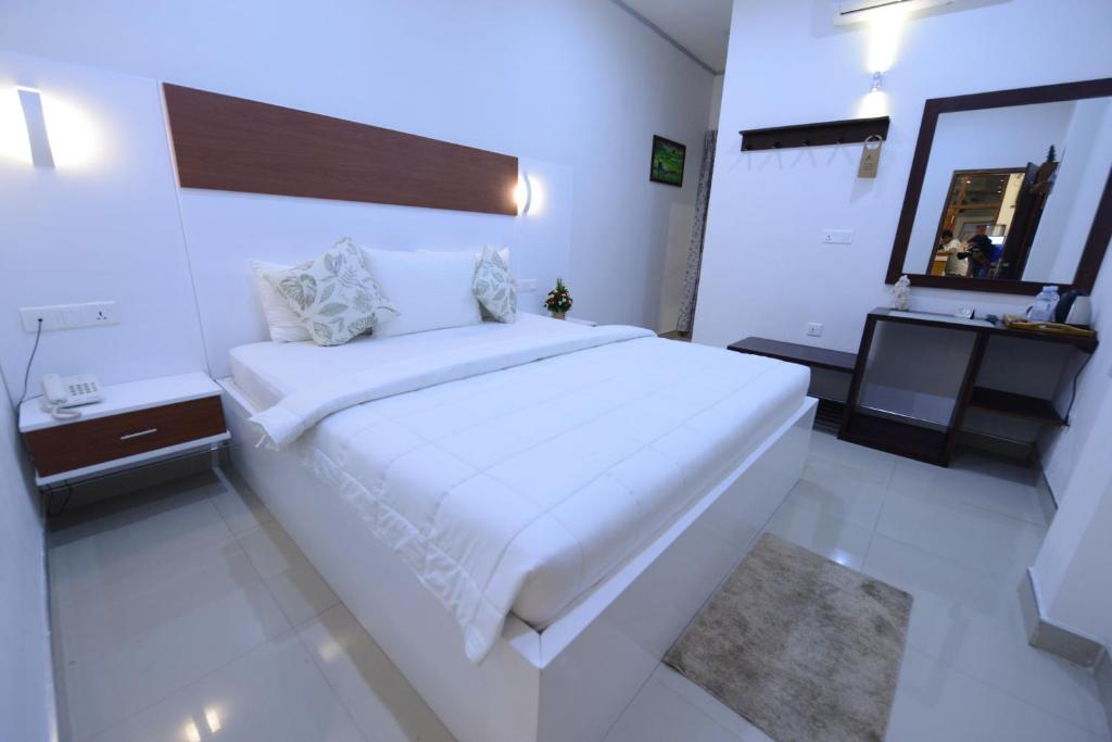 Postel nebo postele na pokoji v ubytování Diva Villa Airport Transit Hotel