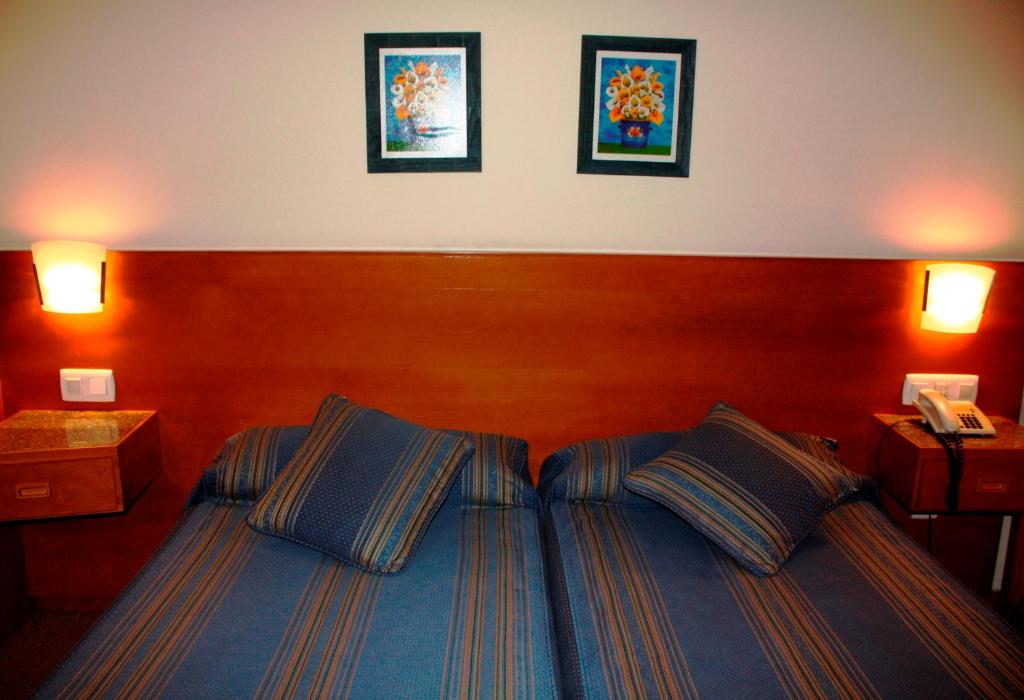 Postel nebo postele na pokoji v ubytování Hotel das Taipas