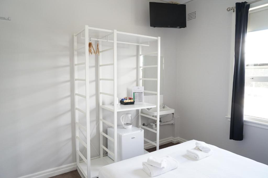 Postel nebo postele na pokoji v ubytování Grand Hotel Rockdale