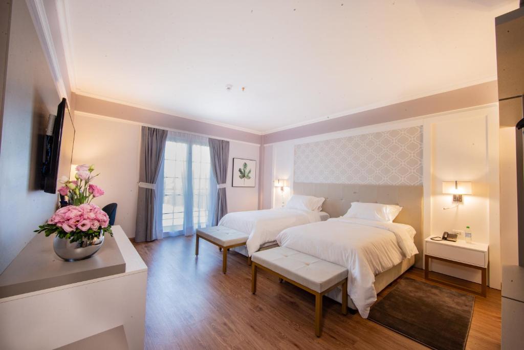 Postel nebo postele na pokoji v ubytování Bisinii Boutique Hotel