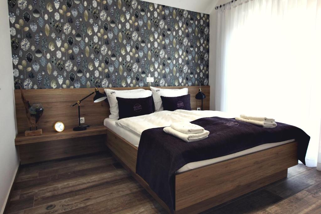 Postel nebo postele na pokoji v ubytování Apartments The Art House
