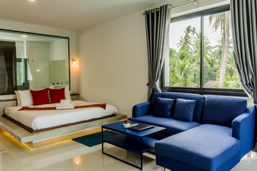 Postel nebo postele na pokoji v ubytování Am Samui Resort Taling Ngam