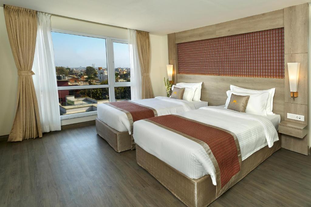 Postel nebo postele na pokoji v ubytování Hotel Crowne Imperial