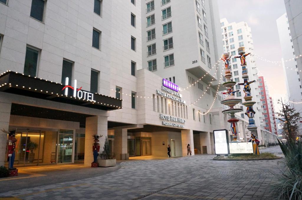 an empty street in a city with tall buildings at Hotel Park Habio in Seoul