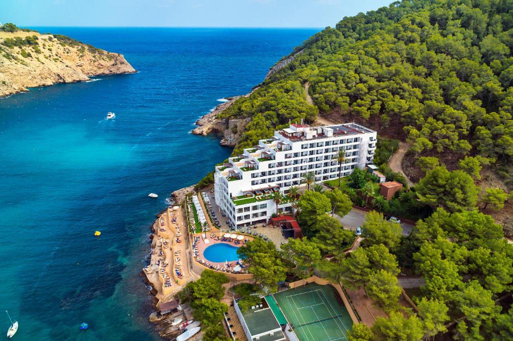 an aerial view of a hotel on a hill next to the water at Palladium Hotel Cala Llonga - Adults Only in Cala Llonga