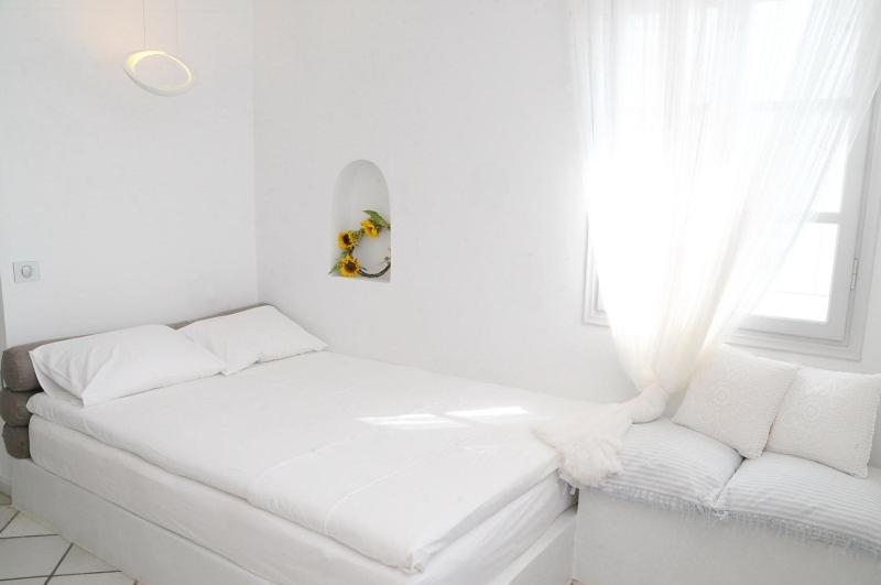 A bed or beds in a room at Archondoula Studios