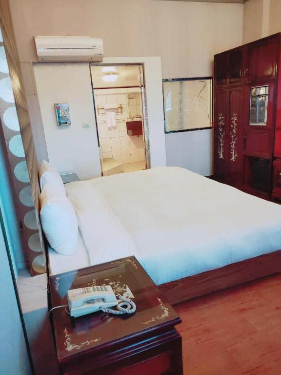Postel nebo postele na pokoji v ubytování Keton Motel Hualien