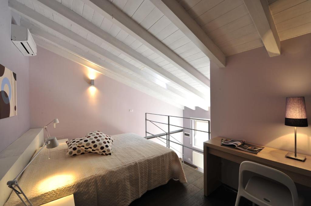 Postel nebo postele na pokoji v ubytování Foresteria Pellegrino